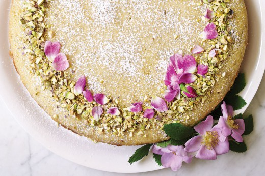 A beautiful cake decorated with rose petals.